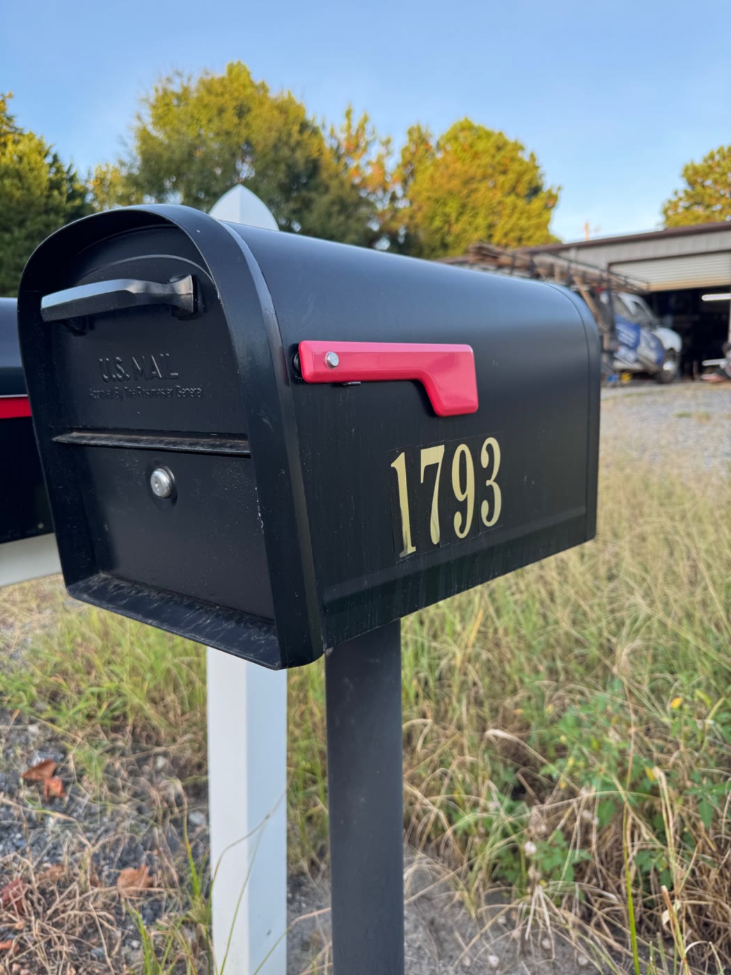Side view of the 1793 key drop-off mailbox across Johnson Road