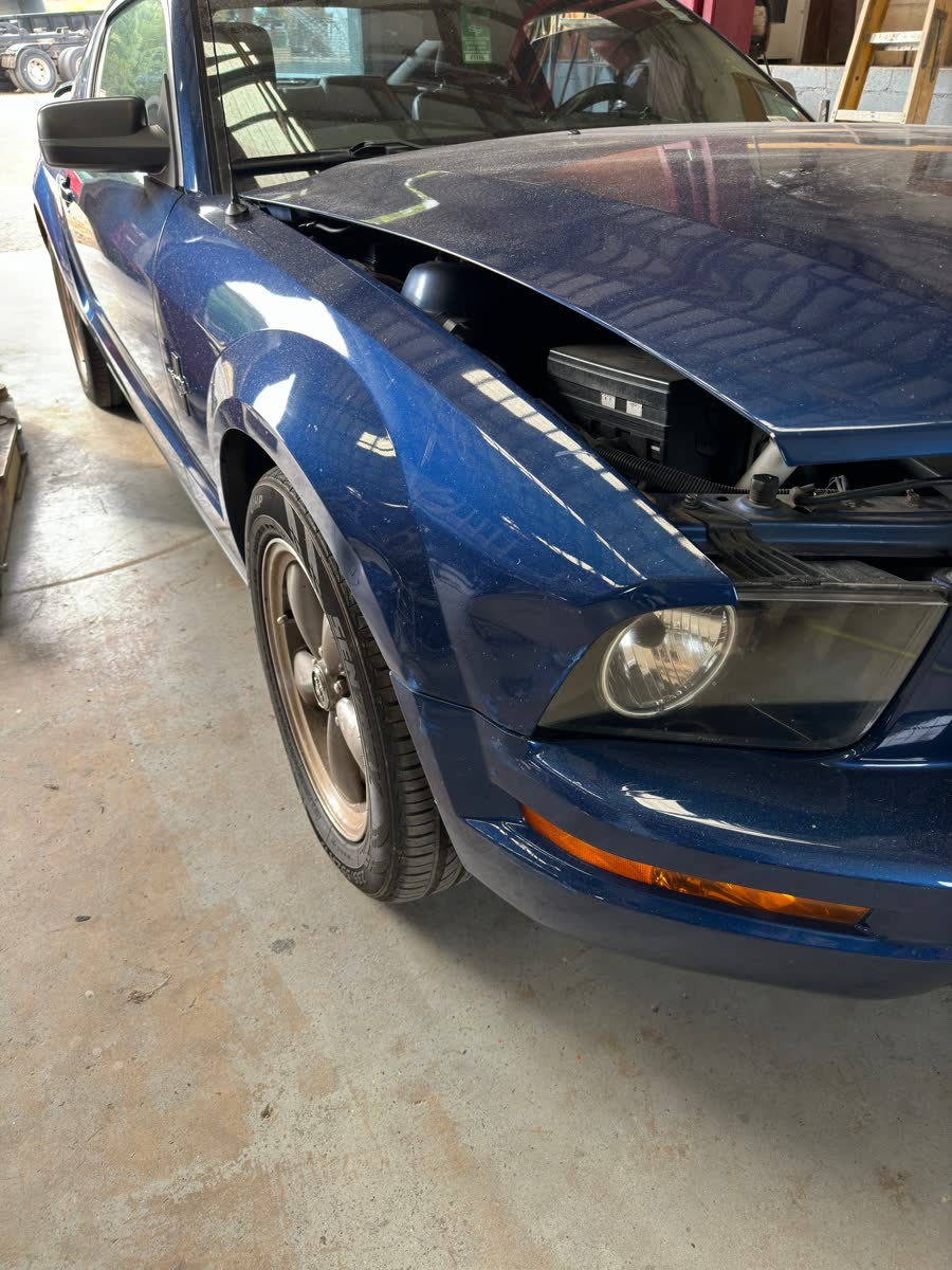 2006 Ford Mustang GT with front fender and bumper collision damage